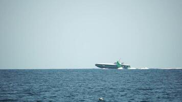 A high speed boat is sailing in the calm ocean. video