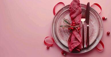 Plate, Napkin, and Fork on Pink Background photo