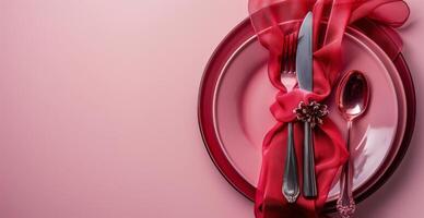 Plate, Napkin, and Fork on Pink Background photo