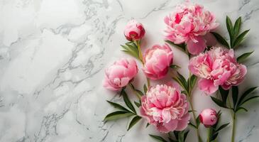 Pink Peonies on a Marble Surface photo