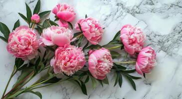 Pink Peonies on a Marble Surface photo
