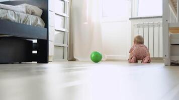 Crawling funny baby girl indoors at home video