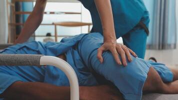 Patient at the physiotherapy doing physical exercises with his therapist video