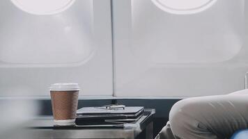 Side view portrait of handsome bearded businessman working while enjoying flight in first class, copy space video