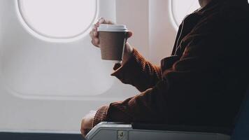 Side view portrait of handsome bearded businessman working while enjoying flight in first class, copy space video