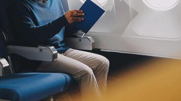 Side view portrait of handsome bearded businessman working while enjoying flight in first class, copy space video