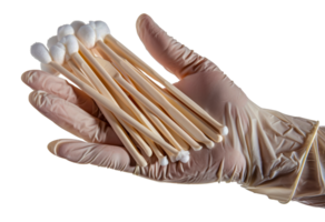 A hand holding a bunch of cotton swabs - stock .. png
