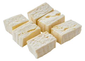 Four pieces of white cheese with black specks - stock .. png