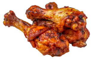 A plate of four chicken wings with a lot of sauce on them - stock .. png