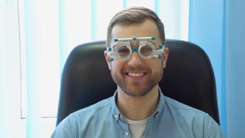 A handsome male patient wearing special ophthalmic glasses video