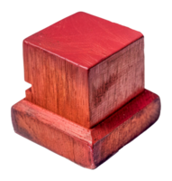 A wooden block with a red top sits - stock .. png