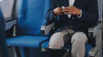 Side view portrait of handsome bearded businessman working while enjoying flight in first class, copy space video