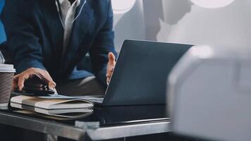 Side view portrait of handsome bearded businessman working while enjoying flight in first class, copy space video