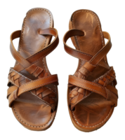 Two brown sandals with a woven design on the straps - stock .. png