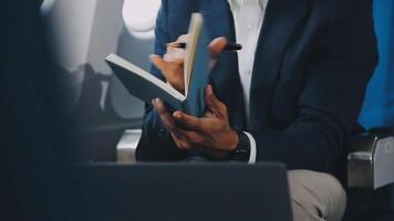 Side view portrait of handsome bearded businessman working while enjoying flight in first class, copy space video