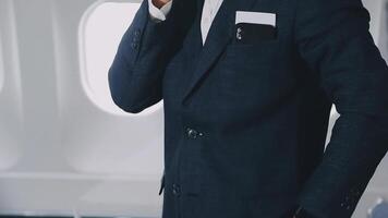 Side view portrait of handsome bearded businessman working while enjoying flight in first class, copy space video