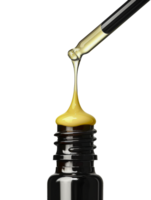 Dropper bottle dispensing organic yellow oil, cut out - stock . png