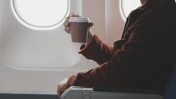 Side view portrait of handsome bearded businessman working while enjoying flight in first class, copy space video