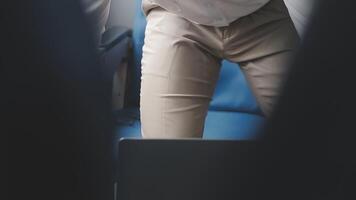 Side view portrait of handsome bearded businessman working while enjoying flight in first class, copy space video