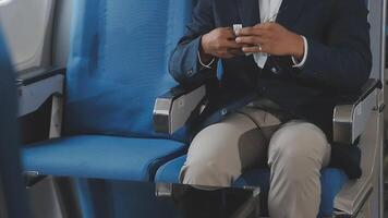 Side view portrait of handsome bearded businessman working while enjoying flight in first class, copy space video