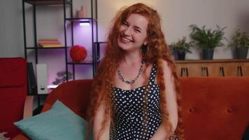 Redhead young woman laughing out loud after hearing ridiculous anecdote, funny joke, feeling amused video