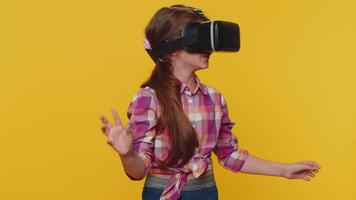 Child girl kid using virtual reality VR app headset to play simulation 3D game watching video