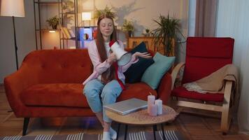 Young teen child girl kid talking with megaphone, proclaiming news, loudly announcing advertisement video