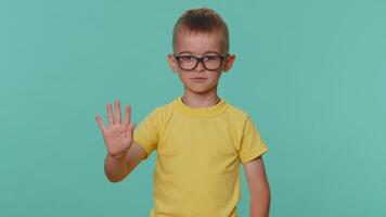 Toddler children boy say no hold palm folded crossed hands in stop gesture, prohibited access danger video