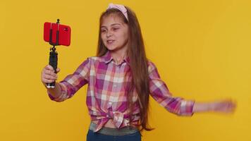 Child girl kid blogger taking selfie on smartphone communicating call online with subscribers video