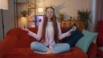 Girl breathes deeply with mudra gesture, eyes closed, meditating with concentrated thoughts peaceful video