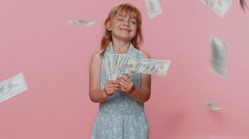 Money cash dollar rain falling on child girl kid celebrating success, winning lottery jackpot luck video