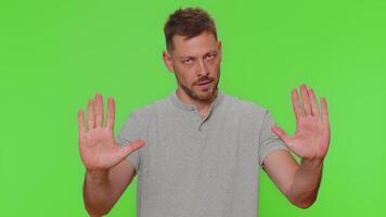 Guy say No hold palm folded crossed hands in stop gesture, warning of finish, prohibited access video