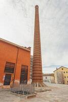 MODENA ITALY 1 OCTOBER 2020 Detail of a Old Industrial building with chimney in Italy photo