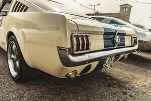 Vicenza Italy 19 March 2024 Close up on the distinctive tail lights of a Shelby Mustang highlighting its unique design photo