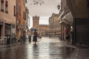 FERRARA ITALY 29 JULY 2020 Evocative view of the street that leads to Piazza Trento Trieste in Ferrara in Italy with people in their daily lives photo