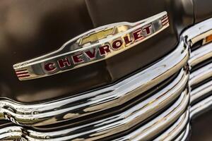 Vicenza Italy 19 March 2024 Detailed view of the Chevrolet emblem on a car showcasing the logo prominently photo