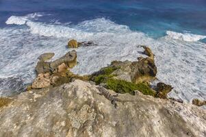 Rocks overlooking the Caribbean Sea photo