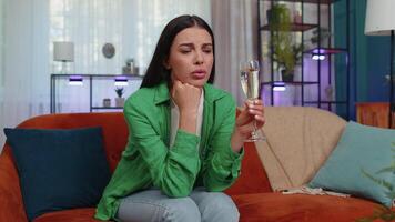 Sad depressed young woman girl suffers from unrequited love, drinking champagne, problem, bad news video