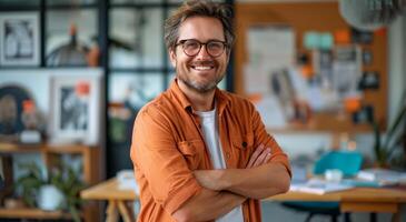 Man in Orange Shirt Standing With Arms Crossed photo