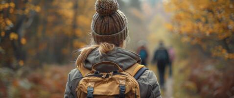 Person Walking Through Forest With Backpack photo