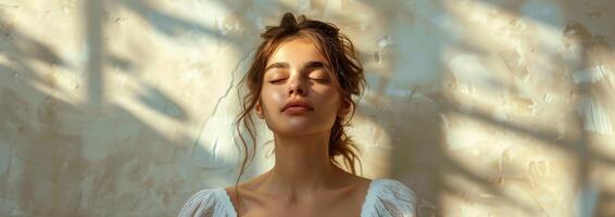 Woman With Closed Eyes Standing in Front of Wall photo