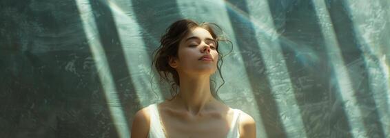 Woman With Closed Eyes Standing in Front of Wall photo