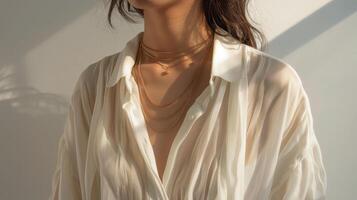 Woman Wearing White Shirt and Necklace photo