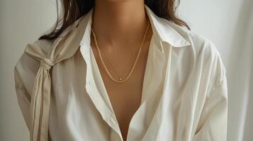 Woman Wearing White Shirt and Necklace photo