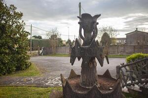 Concrete fountain in the garden photo