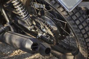Detail of the chained transmission of a vintage motorcycle. photo