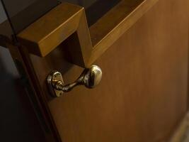 Luxurious wooden door handle photo