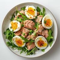 White Bowl Filled With Green Vegetables and Hard Boiled Eggs photo