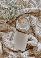Coffee Cup and Book on Blanket photo