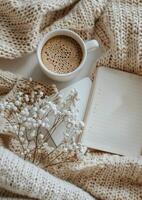 Coffee Cup and Book on Blanket photo